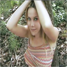 Beside the railway line tied to a tree!